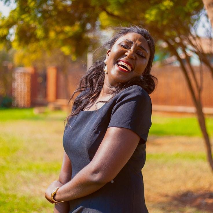 Avery Chen, Lead Design Curator at Copper Dawn Ridge, reviewing corporate floral arrangements